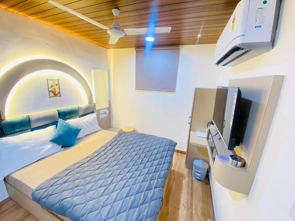 Postel nebo postele na pokoji v ubytování Hotel RV Residency