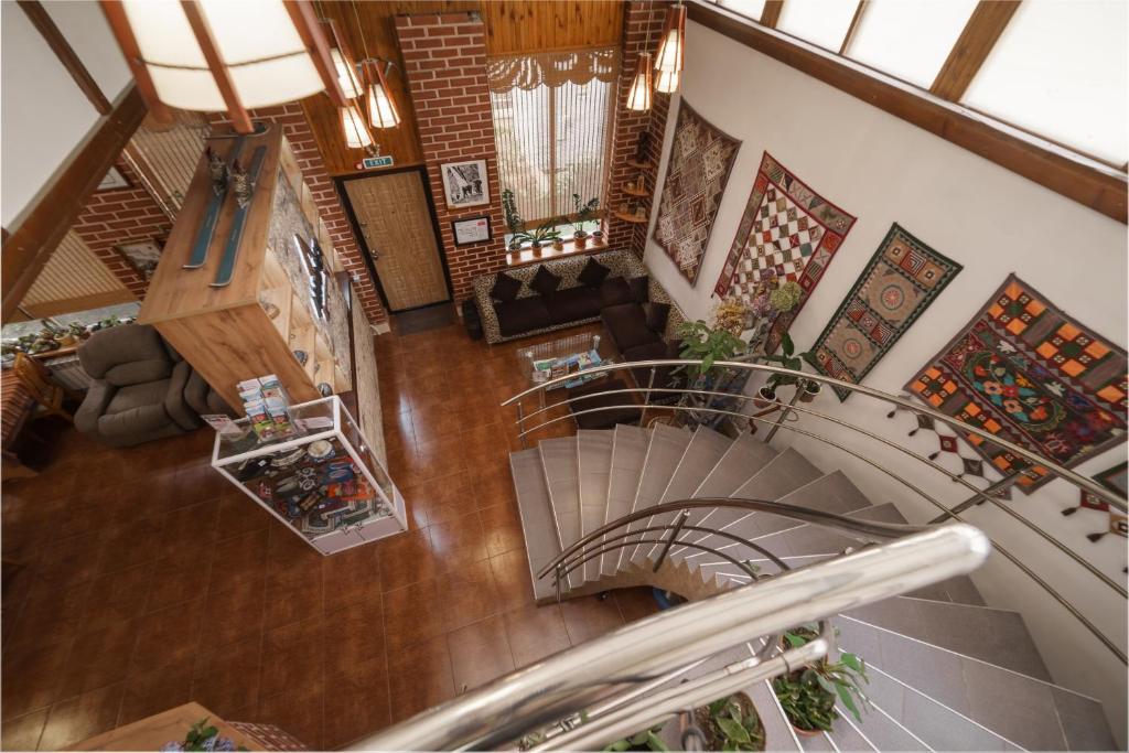 an overhead view of a spiral staircase in a building at Alpinist Hotel in Bishkek
