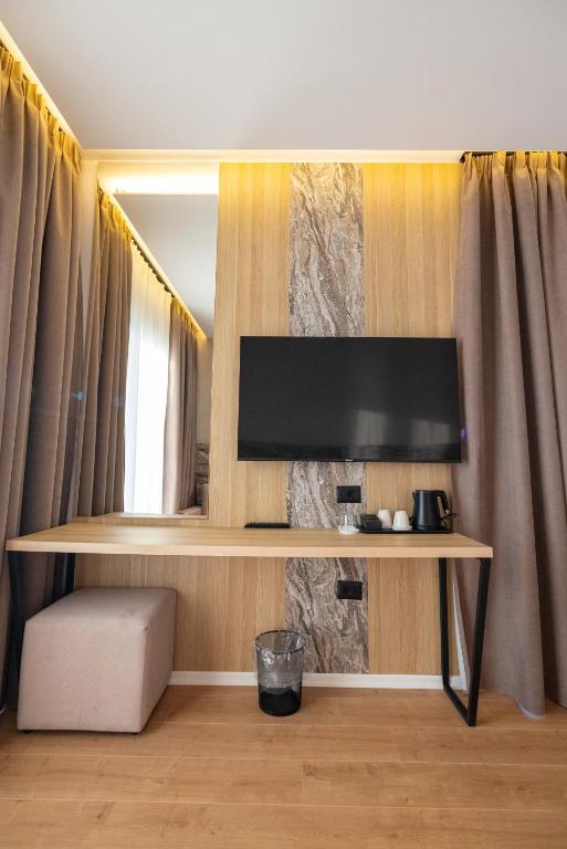 TV a/nebo společenská místnost v ubytování Tris3 Hotel