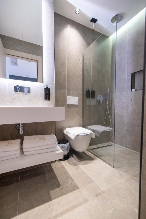 Koupelna v ubytování Tris3 Hotel