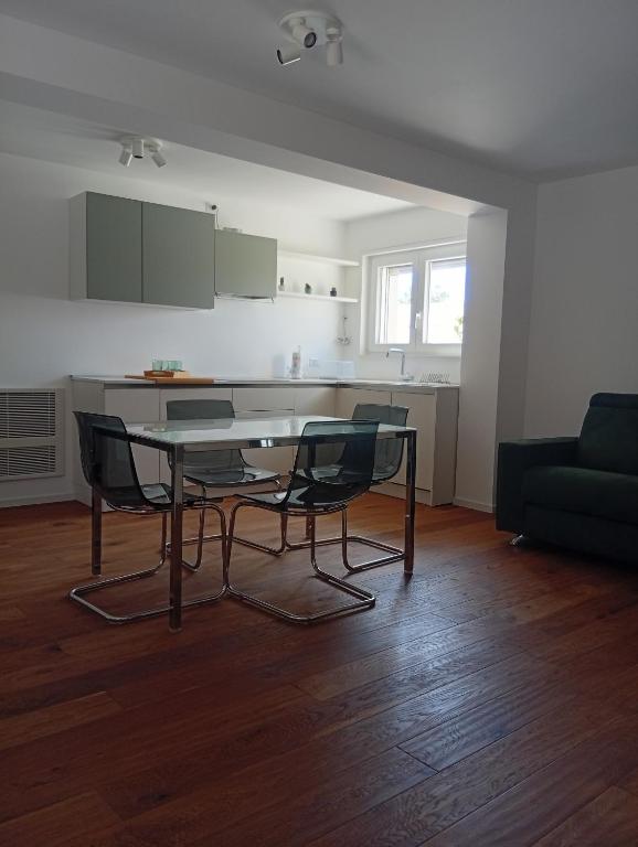 a kitchen with a table and chairs in a living room at Al Settimo Chilometro in Gioia del Colle