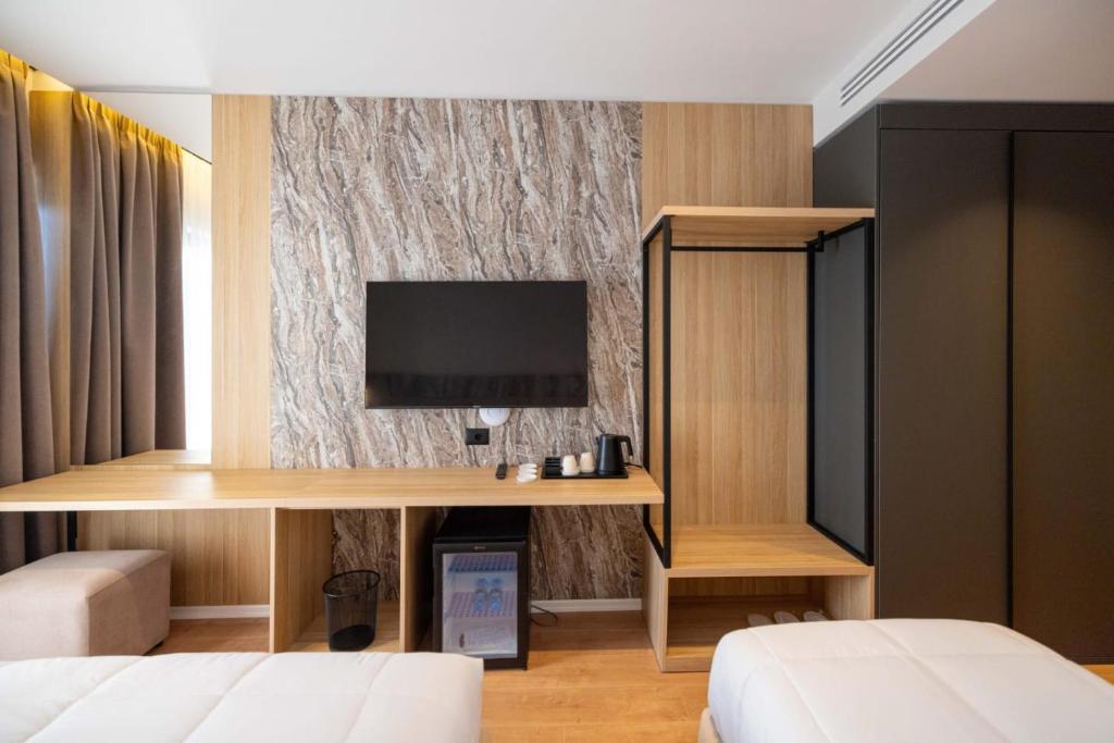 Postel nebo postele na pokoji v ubytování Tris3 Hotel