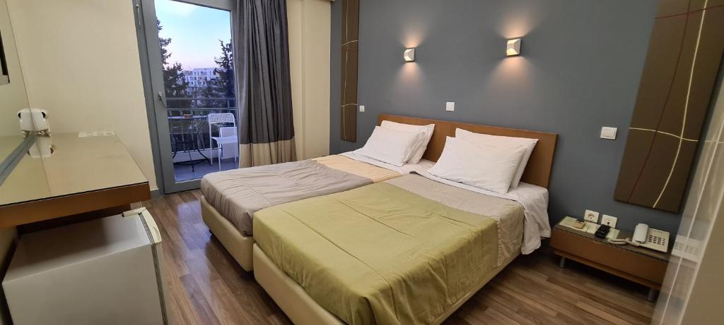 Postel nebo postele na pokoji v ubytování Ariston Hotel
