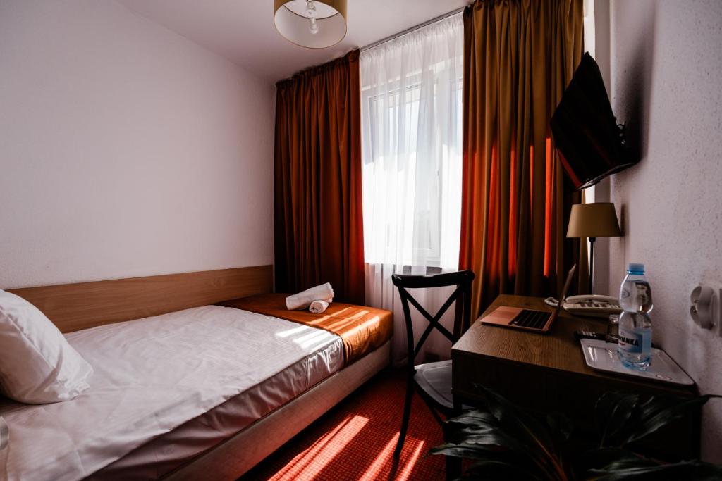 Posteľ alebo postele v izbe v ubytovaní Hotel Wodnik