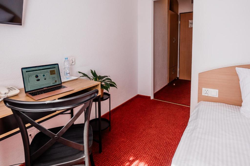 Posteľ alebo postele v izbe v ubytovaní Hotel Wodnik