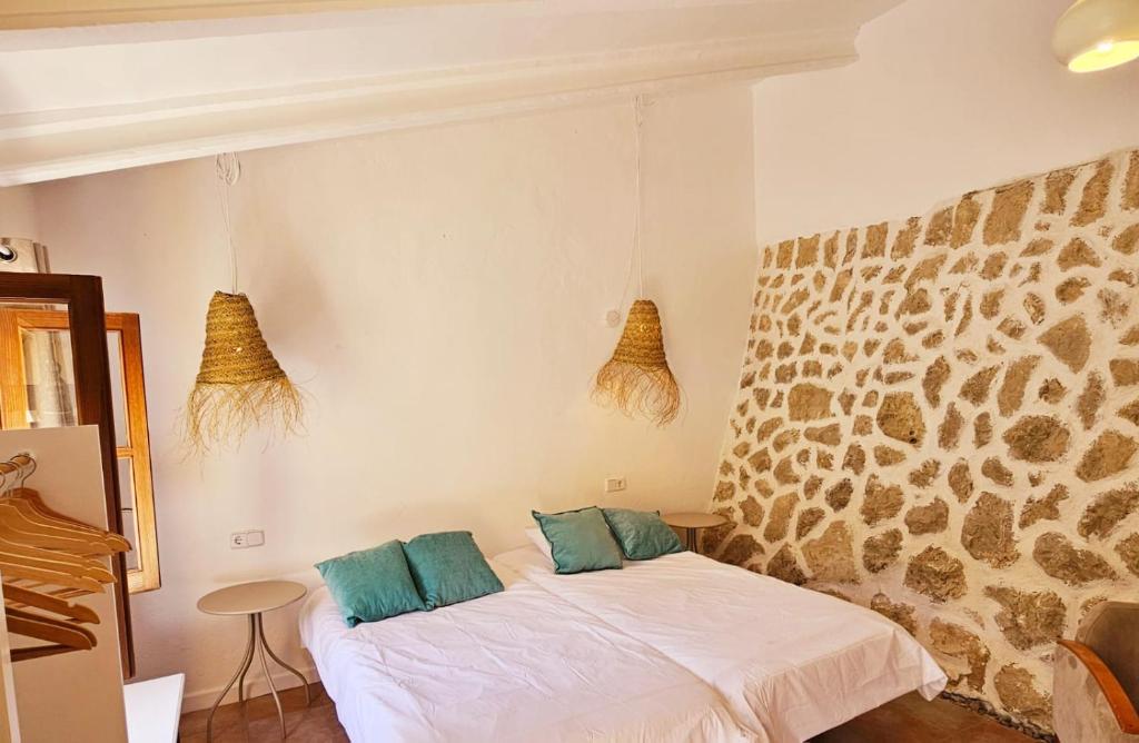 Postel nebo postele na pokoji v ubytování Agroturismo Finca Can Sec