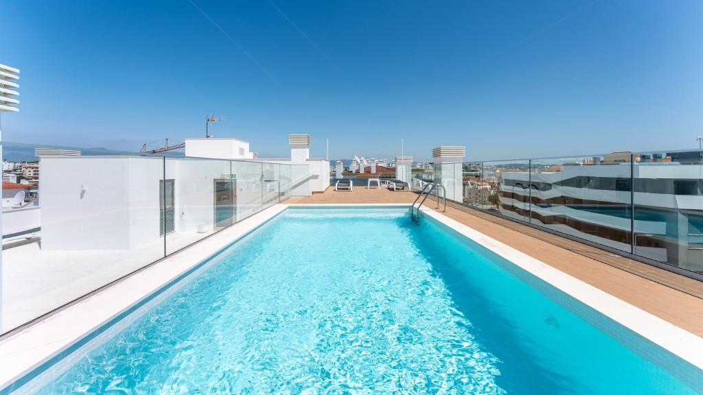 Modern 2BR w Rooftop Pool & Parking by LovelyStay