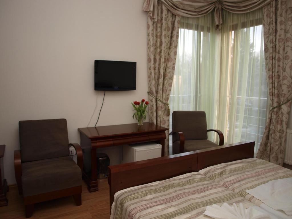 TV a/nebo společenská místnost v ubytování Hotel Oko
