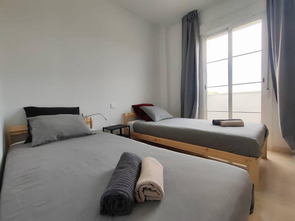 Postel nebo postele na pokoji v ubytování Apartamento Happy Days