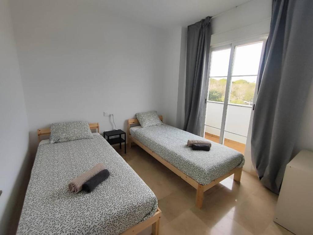 Postel nebo postele na pokoji v ubytování Apartamento Happy Days