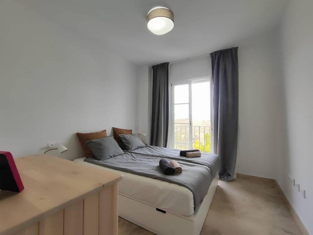 Postel nebo postele na pokoji v ubytování Apartamento Happy Days