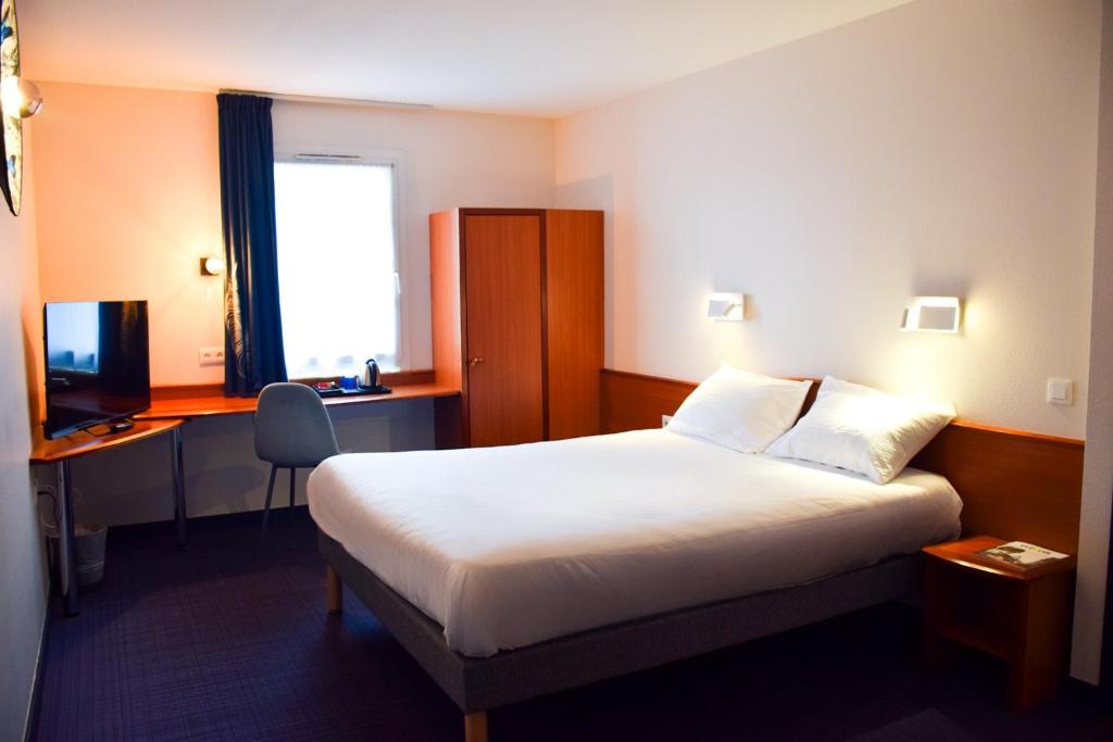 Postel nebo postele na pokoji v ubytování B&B HOTEL Rodez Bourran