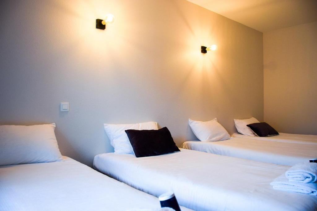 Postel nebo postele na pokoji v ubytování B&B HOTEL Rodez Bourran