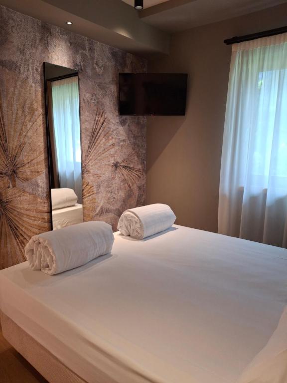 Postel nebo postele na pokoji v ubytování Hotel Dolomiti Saone