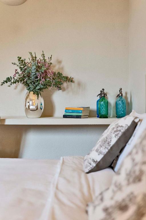 A bed or beds in a room at Cantagrillo Boutique Resort