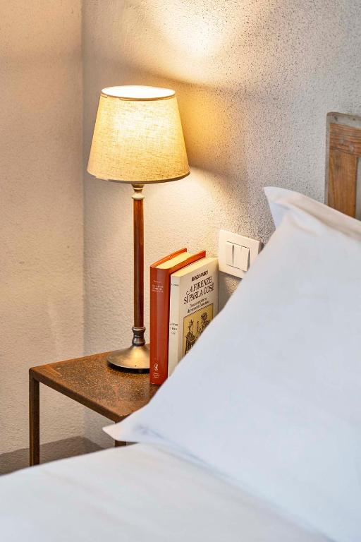 A bed or beds in a room at Cantagrillo Boutique Resort