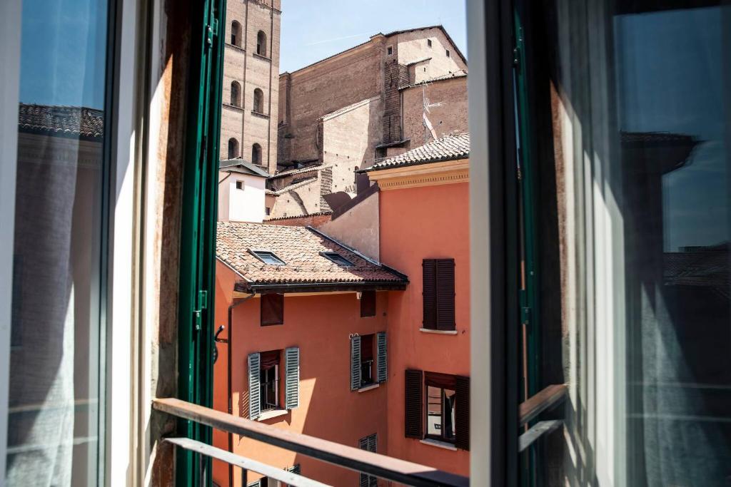 a view of a city from a window at Tesoro Dé Galluzzi in Bologna