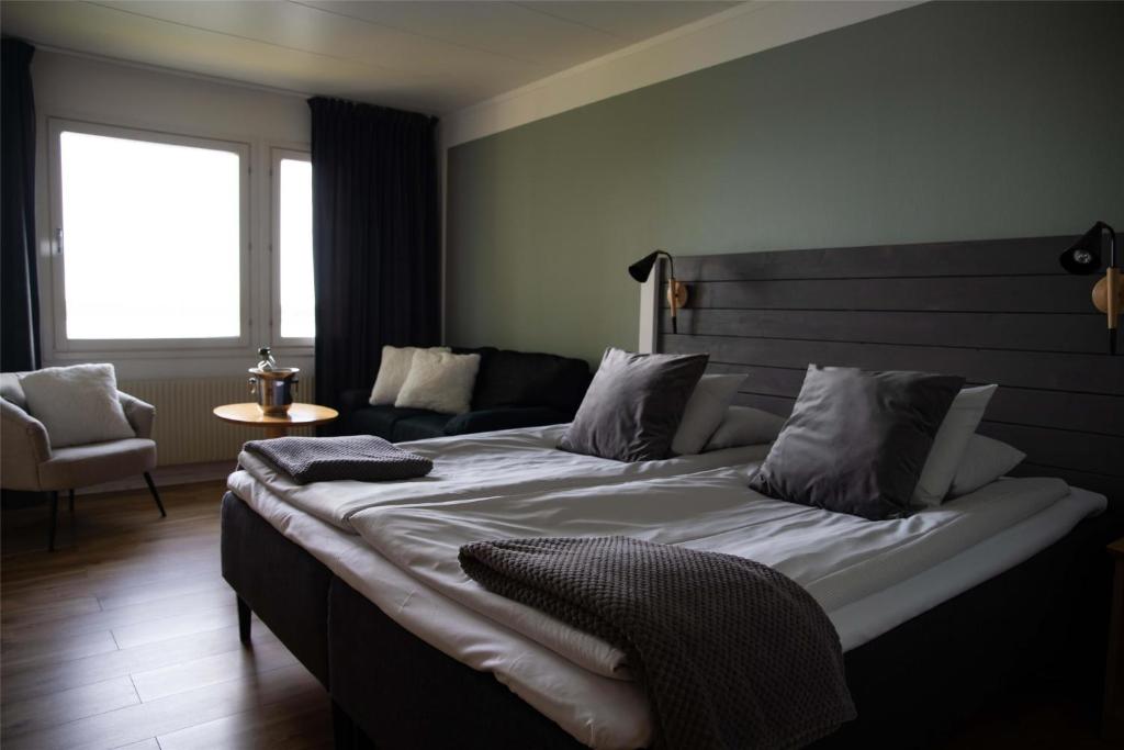 Postel nebo postele na pokoji v ubytování Hotel Ullinge