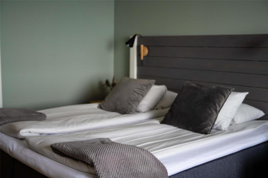 Postel nebo postele na pokoji v ubytování Hotel Ullinge