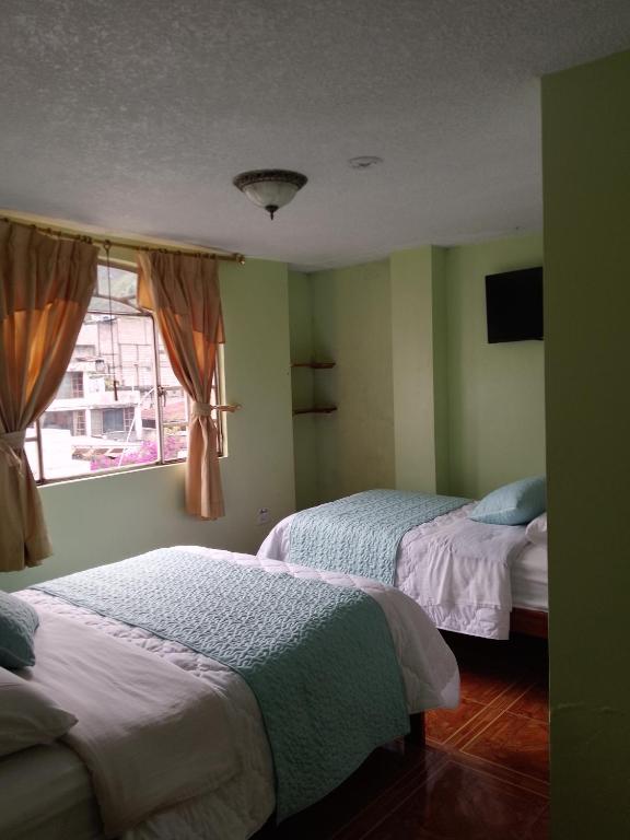 Postel nebo postele na pokoji v ubytování Hotel Amazonia y sol
