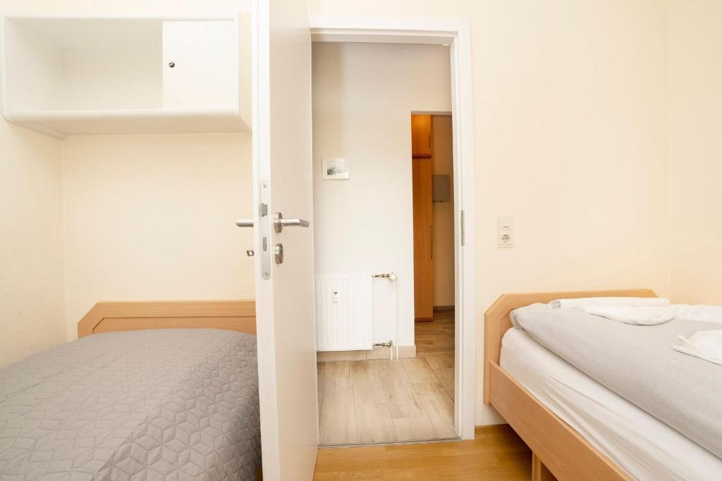 Postel nebo postele na pokoji v ubytování Grömitz Center 313 Am Strande