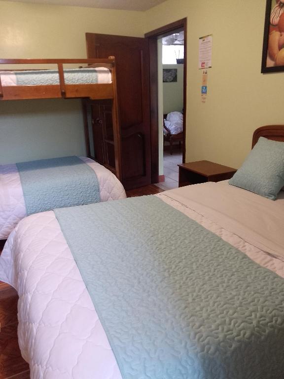 Postel nebo postele na pokoji v ubytování Hotel Amazonia y sol