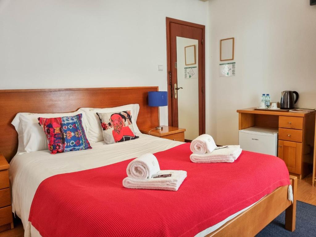 Postel nebo postele na pokoji v ubytování Dolce Vianna - City Centre Rooms