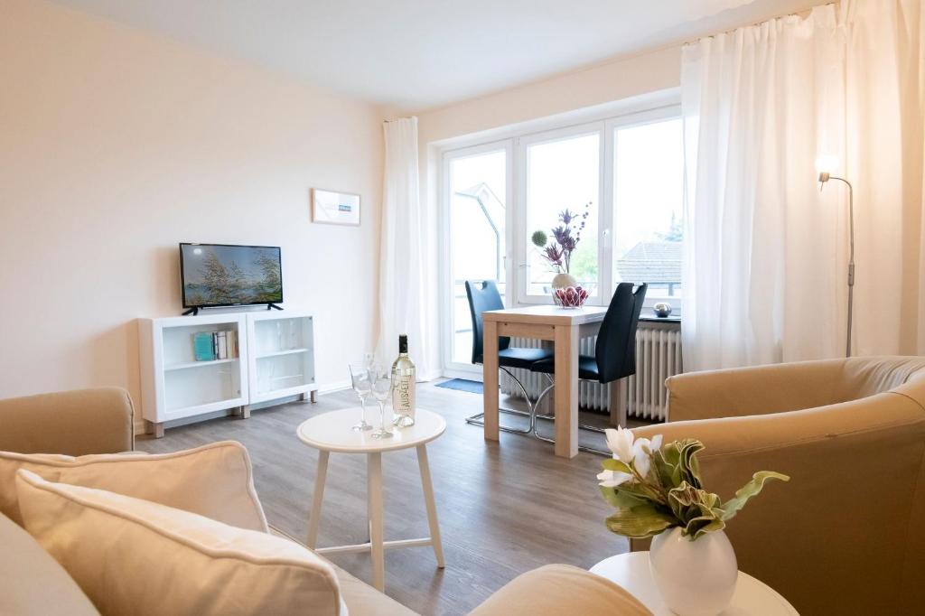 TV a/nebo společenská místnost v ubytování Skippers Hus Liegeplatz