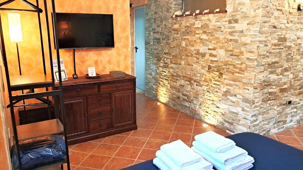 TV a/nebo společenská místnost v ubytování Alloggio Gladiolo
