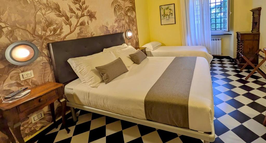 Postel nebo postele na pokoji v ubytování Villa Fieschi Boutique Hotel