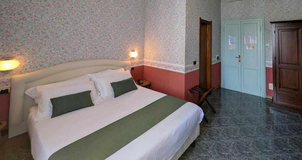 Postel nebo postele na pokoji v ubytování Villa Fieschi Boutique Hotel