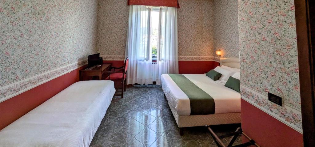 Postel nebo postele na pokoji v ubytování Villa Fieschi Boutique Hotel