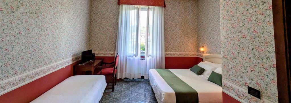 Postel nebo postele na pokoji v ubytování Villa Fieschi Boutique Hotel