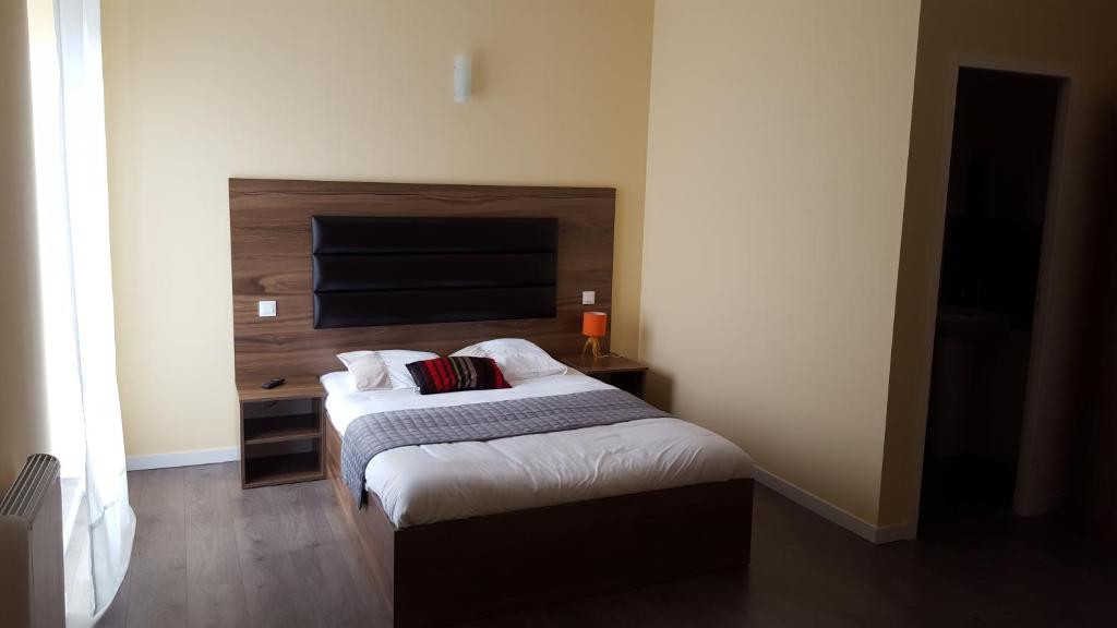 Postel nebo postele na pokoji v ubytování Hotel Morez