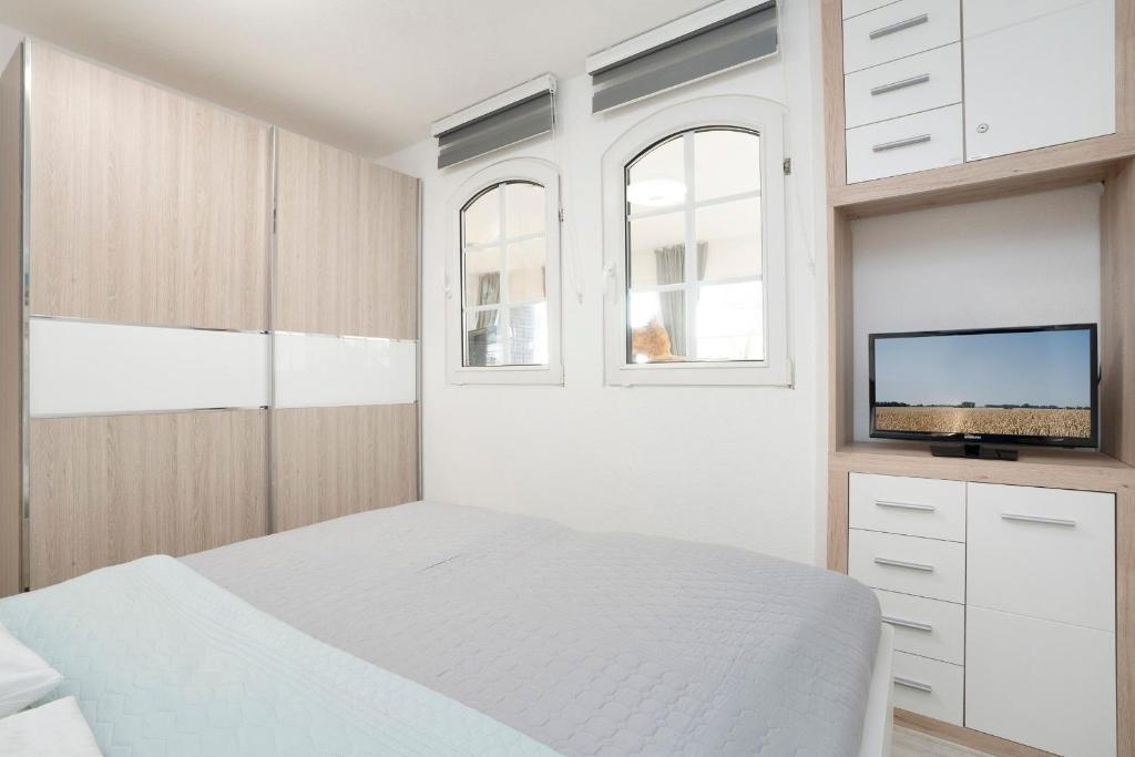 Postel nebo postele na pokoji v ubytování Maretimo Meerblick