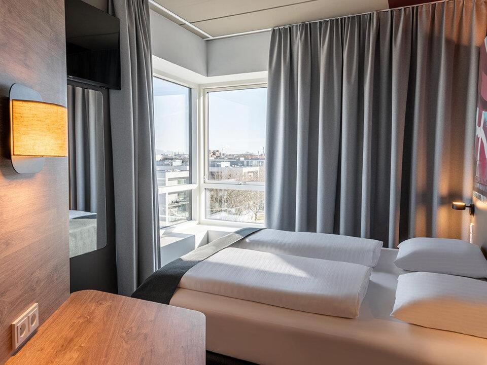 Postel nebo postele na pokoji v ubytování B&B HOTEL Aalborg