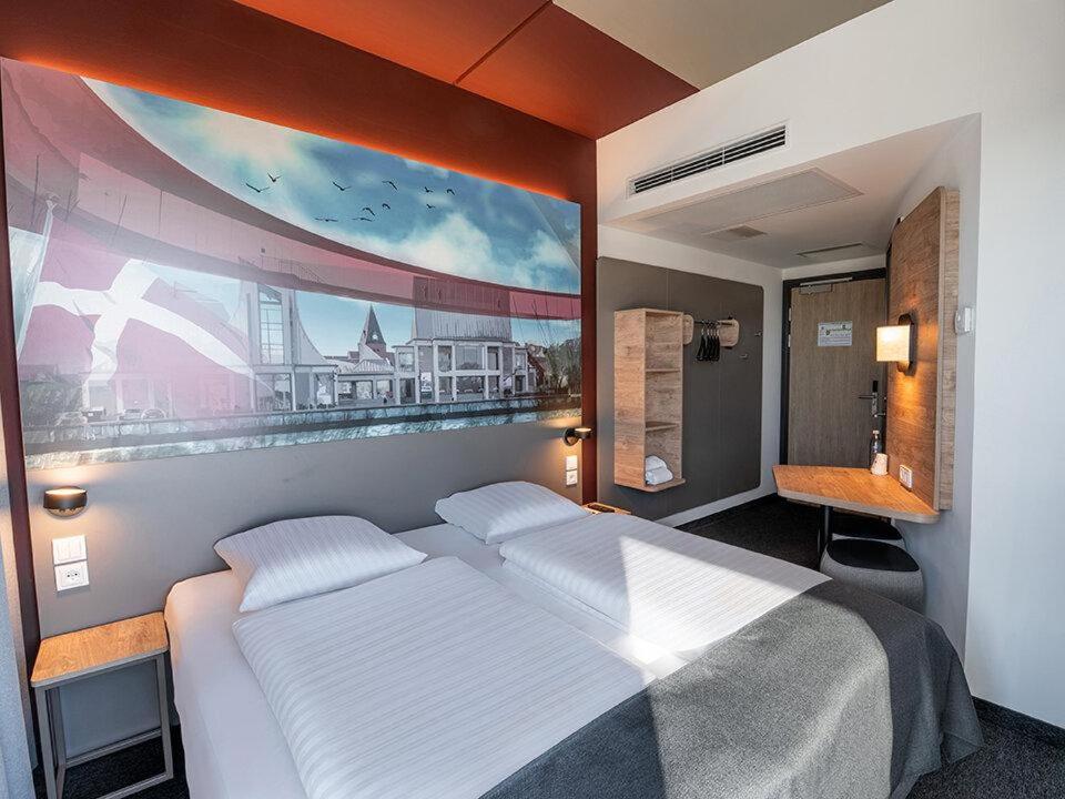 Postel nebo postele na pokoji v ubytování B&B HOTEL Aalborg