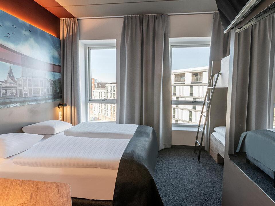 Postel nebo postele na pokoji v ubytování B&B HOTEL Aalborg