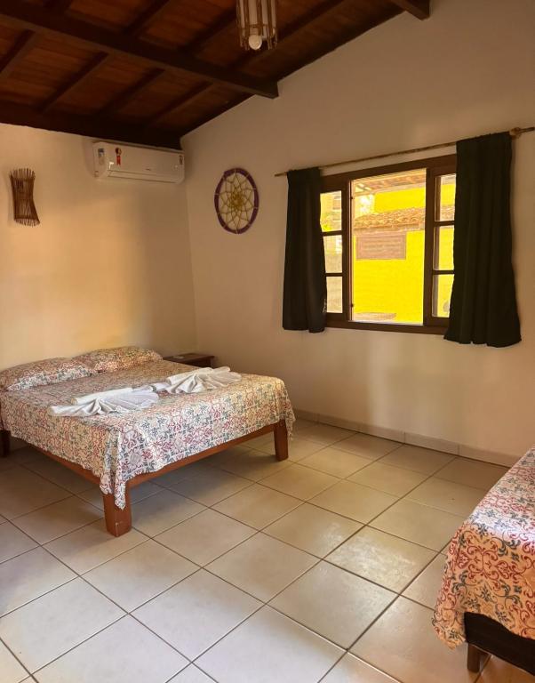 Postel nebo postele na pokoji v ubytování Pousada Arraial dos Sonhos