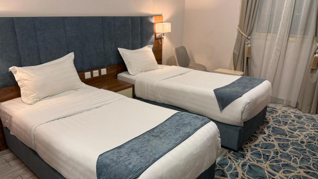 Postel nebo postele na pokoji v ubytování SEAVIEW HOTEL