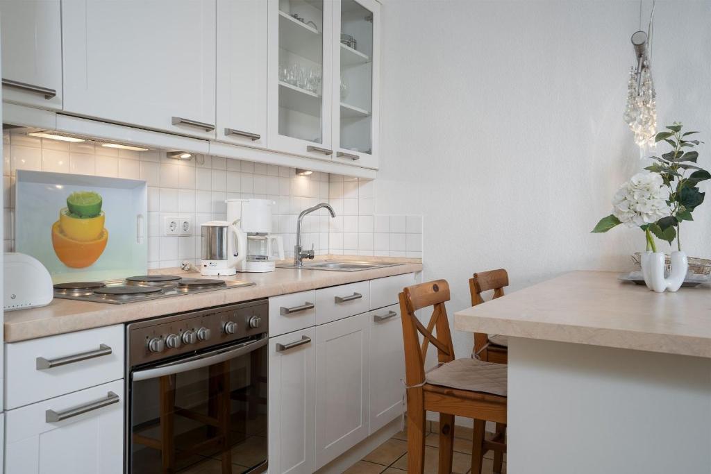 Kuchyň nebo kuchyňský kout v ubytování Strand Domizil Wohnung 2