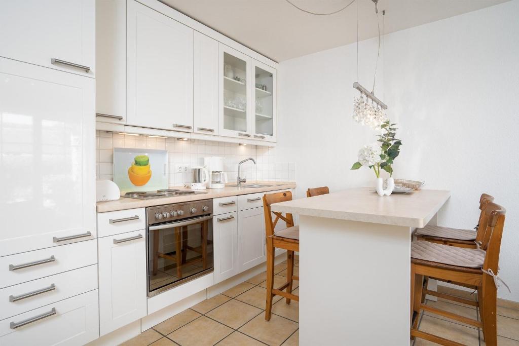 Kuchyň nebo kuchyňský kout v ubytování Strand Domizil Wohnung 2