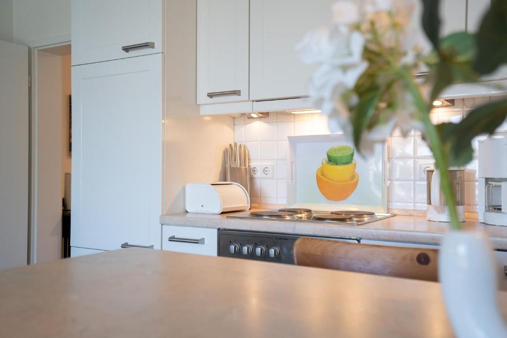 Kuchyň nebo kuchyňský kout v ubytování Strand Domizil Wohnung 2