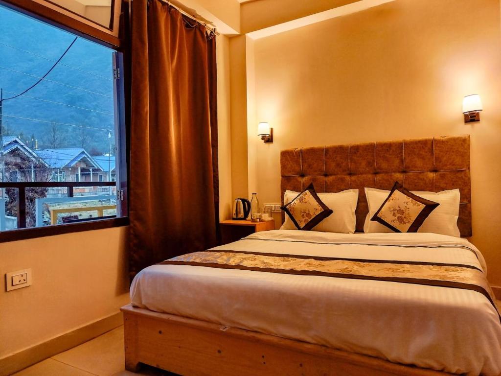 Postel nebo postele na pokoji v ubytování Hotel Fern Hill Lachung