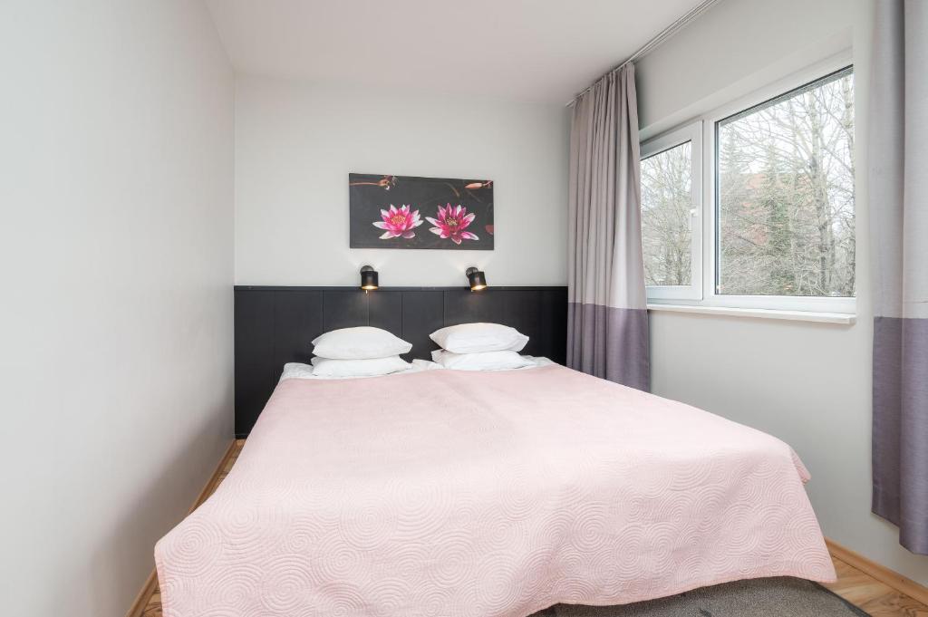 Postel nebo postele na pokoji v ubytování Hotel Emmi