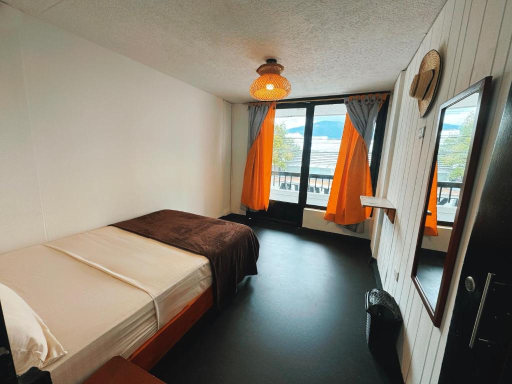 En eller flere senger på et rom på La Chiva Hostal Armenia