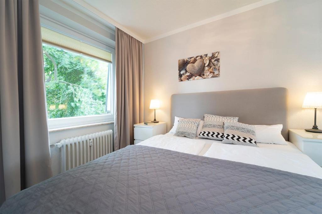 Postel nebo postele na pokoji v ubytování Höppnerweg 5 Carpe Diem Timmendorfer Strand