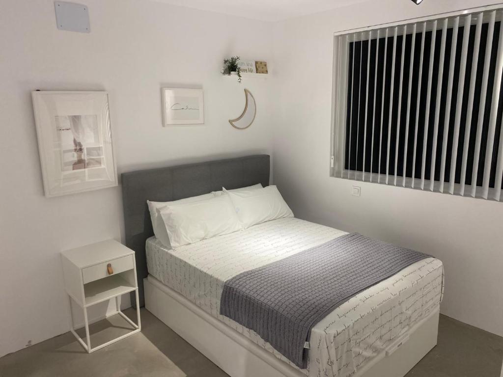 Ένα ή περισσότερα κρεβάτια σε δωμάτιο στο Residencial Smart HOmes