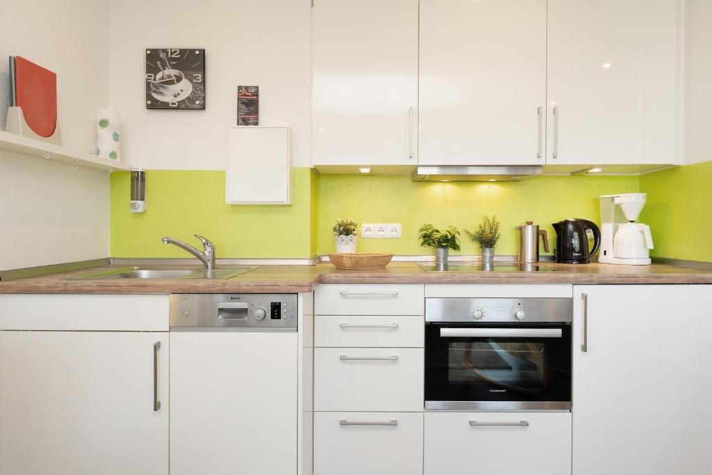 Kuchyň nebo kuchyňský kout v ubytování Seeschlösschen Wohnung 524