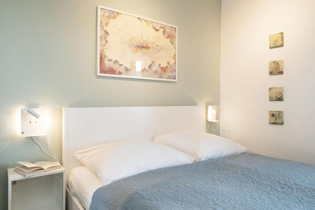Postel nebo postele na pokoji v ubytování Seeschlösschen Wohnung 524